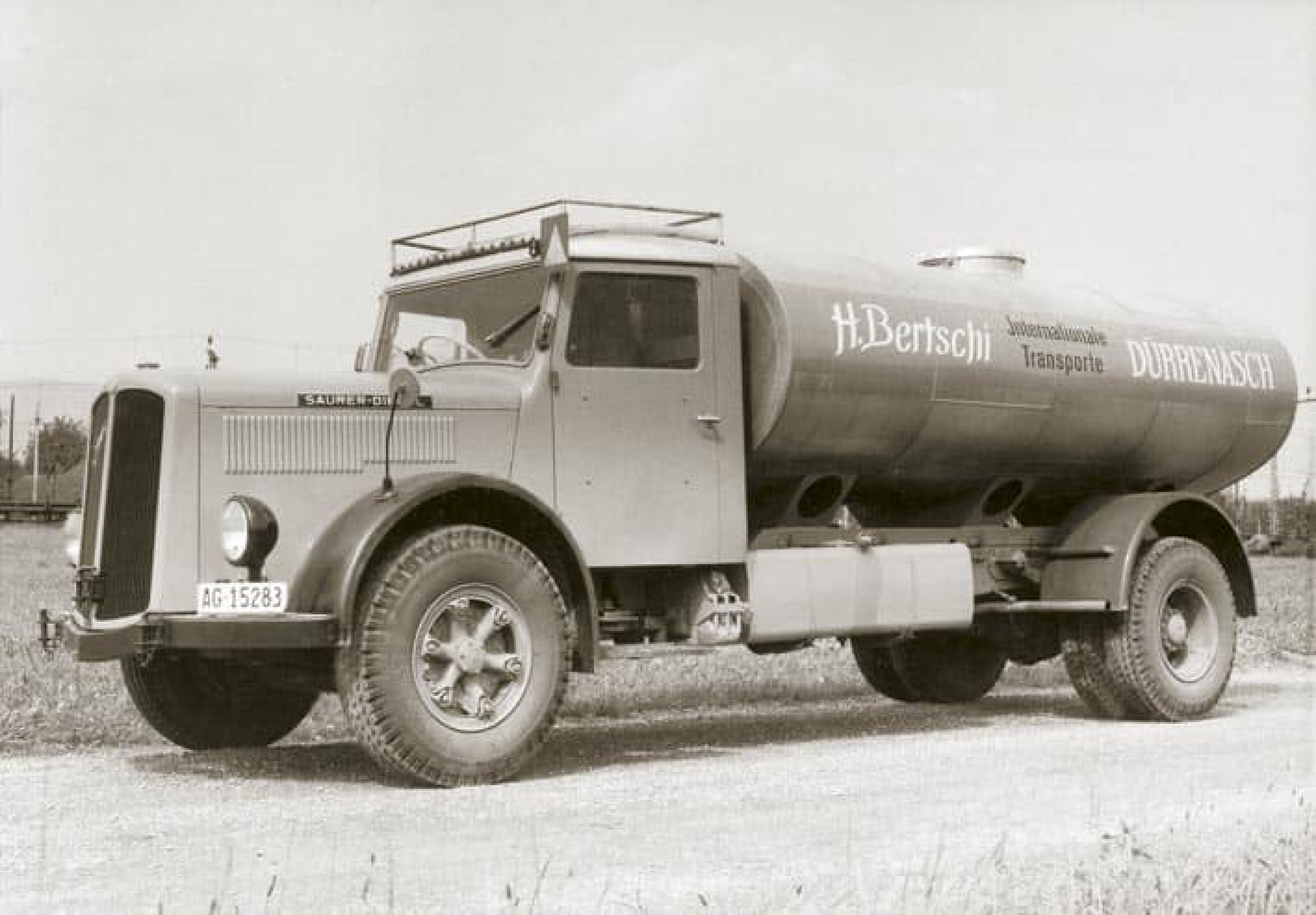 The first Bertschi road tanker truck, a Saurer model, in black and white.