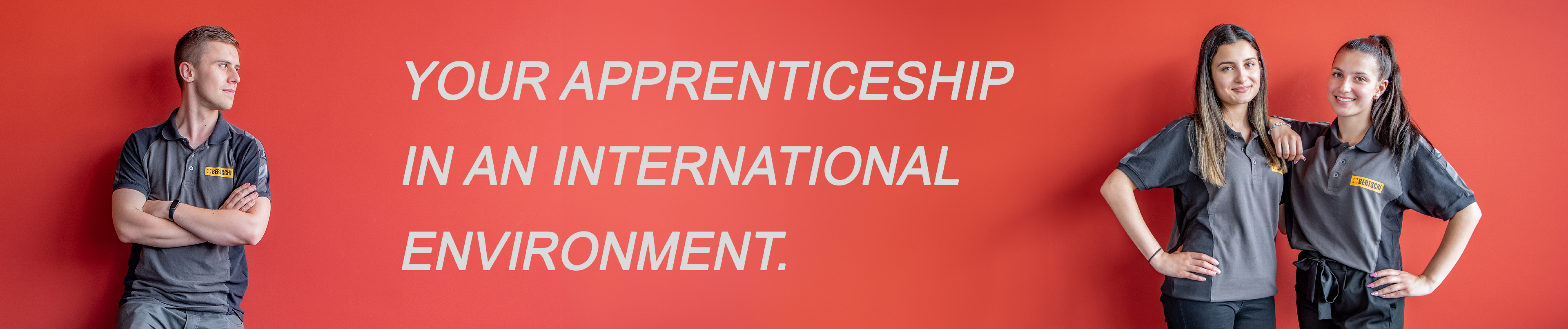red wall with 3 apprentices standing and the text says "your apprenticeship in an international environment"