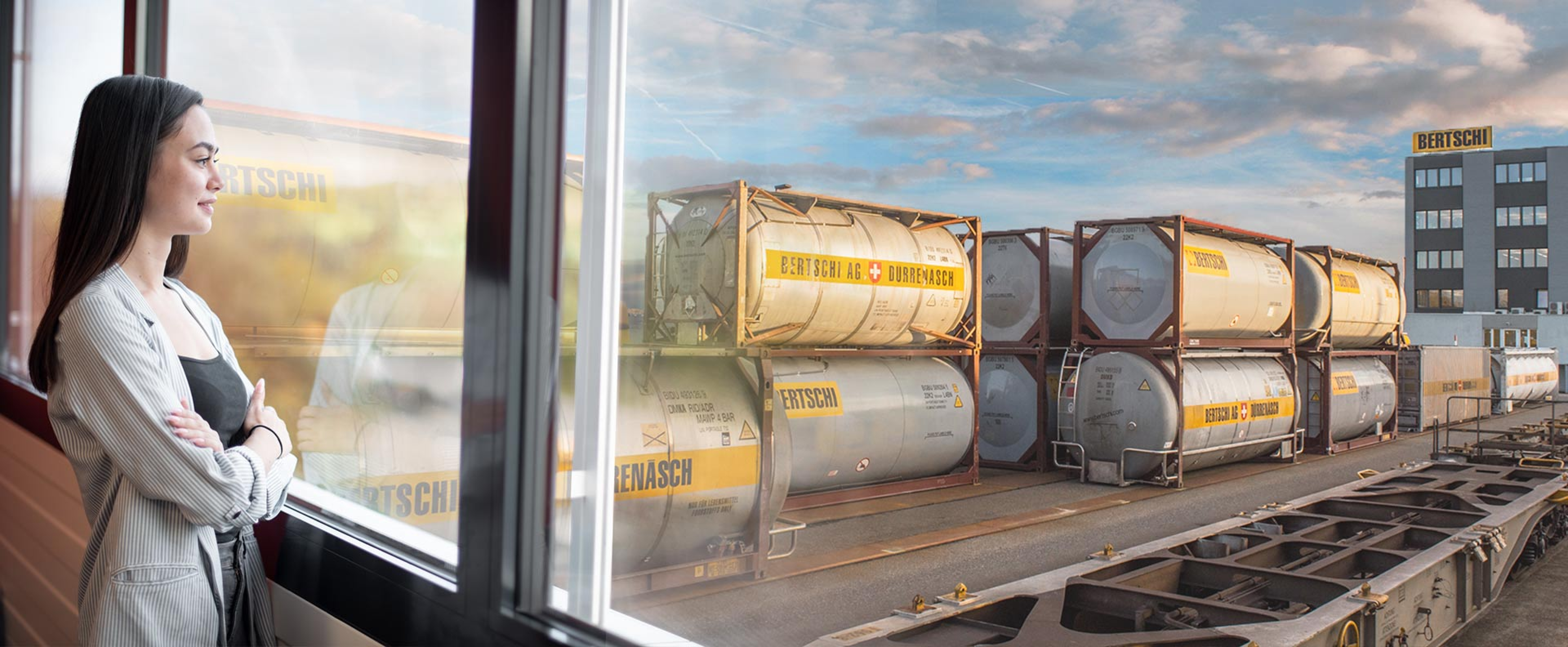 A woman overlooks a BERTSCHI container terminal.