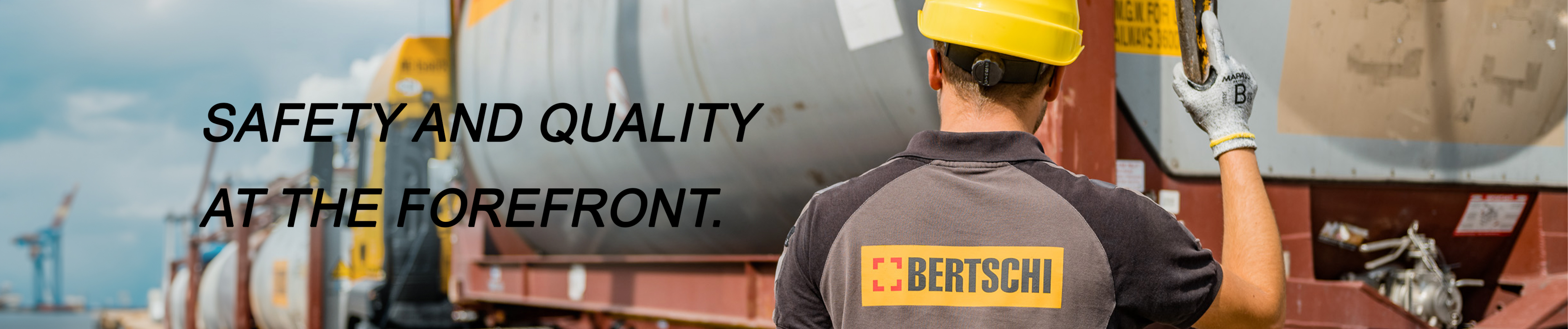 Terminal employee with helmet and the text says Safety and Quality at the forefront.