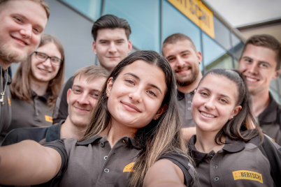 Apprentices doing a group selfie