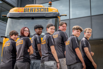 Apprentices  in front of truck 