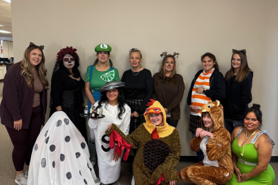 a group of people is dressed up for halloween