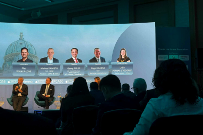 Audience view of a panel discussion at the 60th EPCA Annual Meeting in Vienna, with speakers on stage.