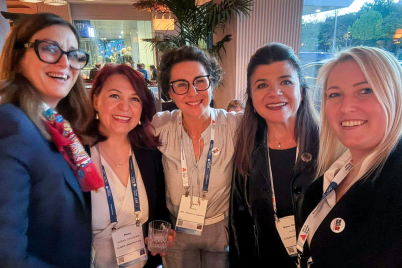 Women attendees share a moment at the EPCA Annual Meeting reception.