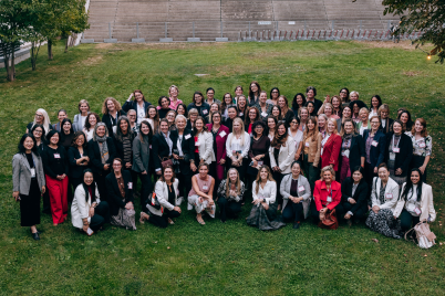 Large group of conference participants gathered outdoors in Vienna.