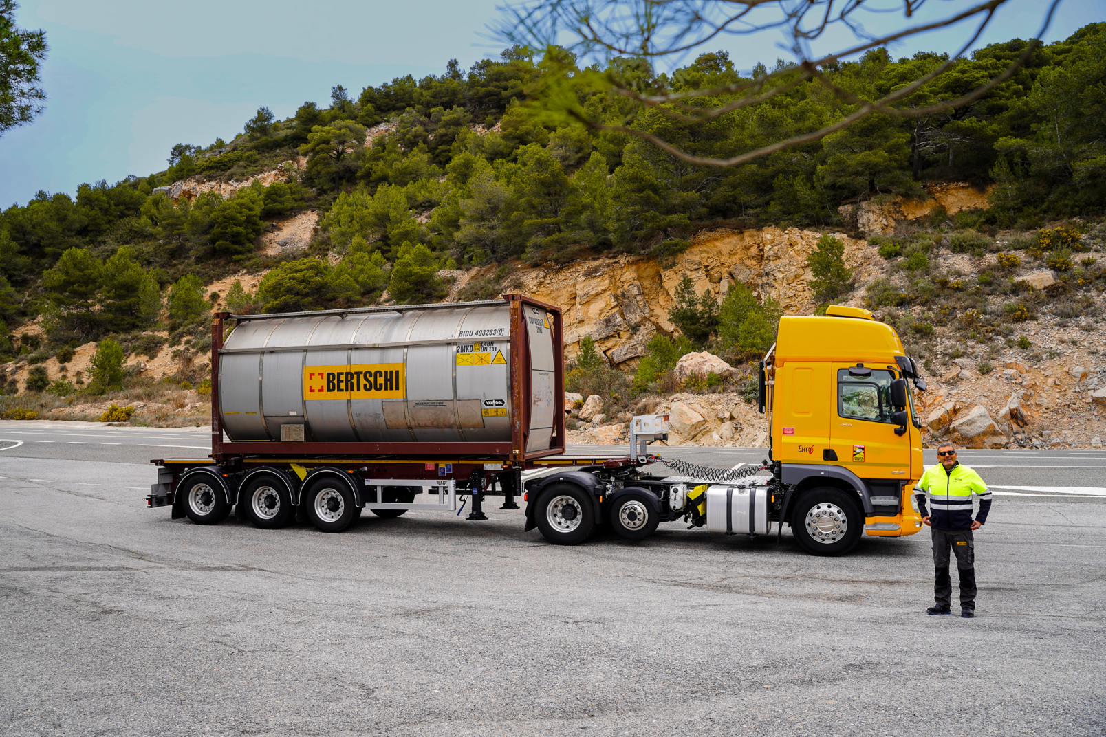 Truck on Tarragona hill with driver standing in front of it