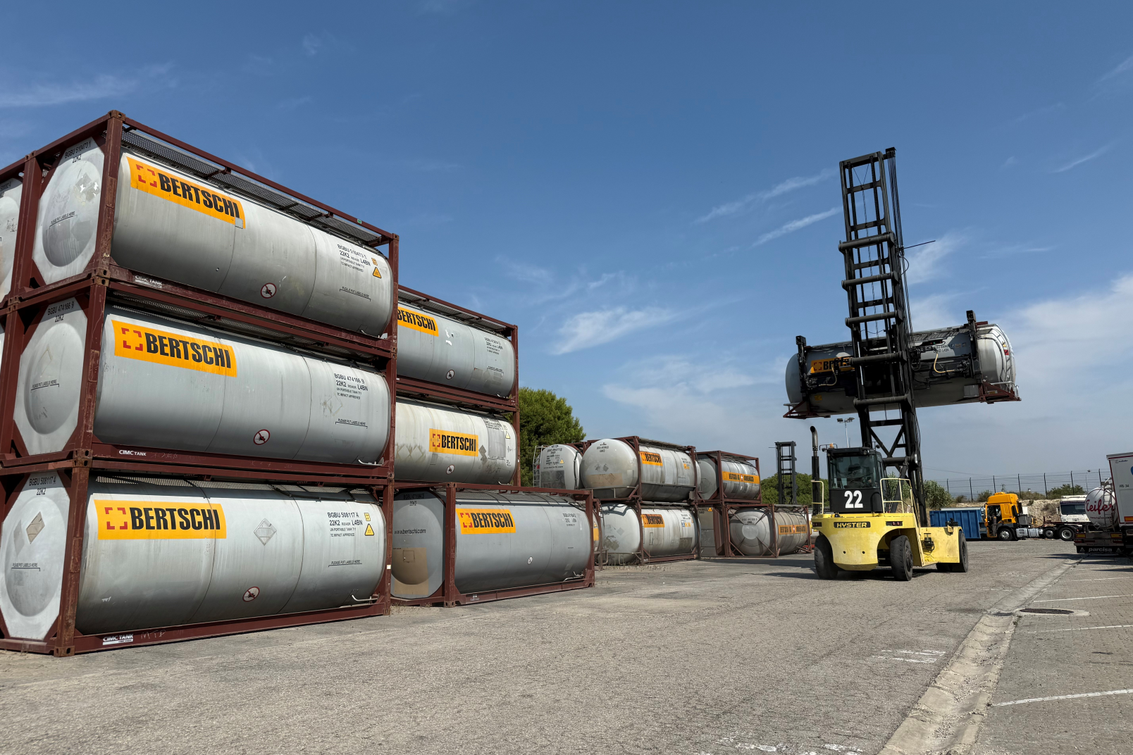 Containers stacked with a stack reacher in the background