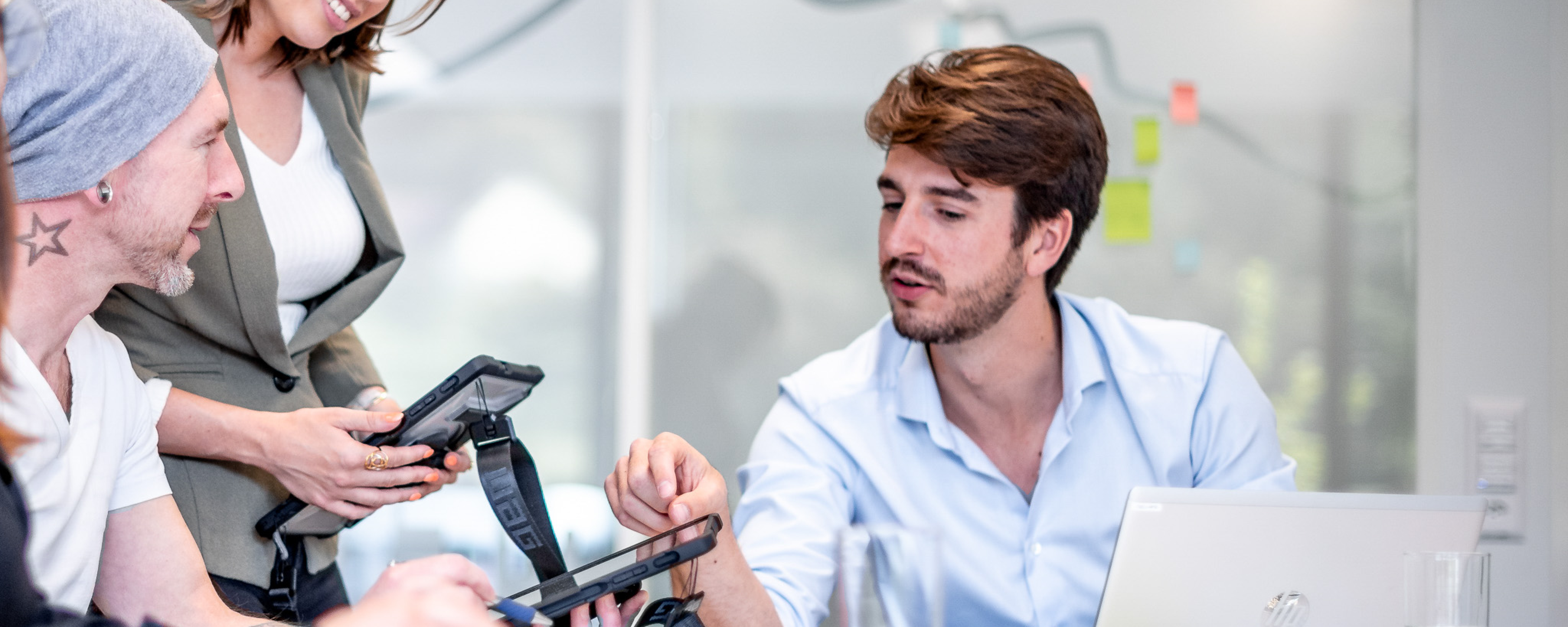 Employees in a meeting with ipads